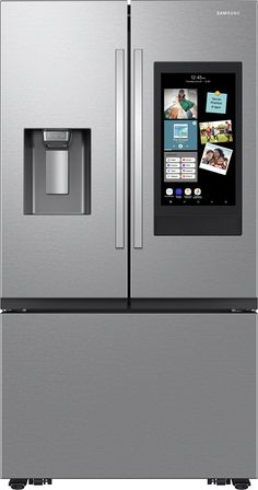 a silver refrigerator freezer sitting next to an appliance with pictures on it