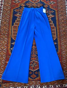 Vintage 1970's blue poly/acrylic pull on pants with elastic waist made by Upstairs Closet.  28" waist unstretched, 29" inseam, 40" length Unworn deadstock with original tags, great condition! Blue Full-length Pull-on Pants, Blue Full Length Pants With Pull-on Style, Blue Wide-leg Pull-on Pants, Retro Blue Straight Leg Pants, Retro Stretch Blue Pants, Retro Blue Stretch Pants, Blue Retro Stretch Pants, Retro High Waist Blue Pants, Blue Stretch Full-length Wide Leg Pants