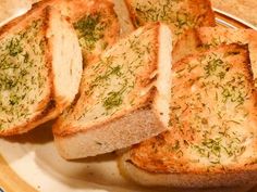 four slices of garlic bread on a plate