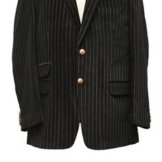 This Chiragh Apparel blazer is an elegant upgrade on dapper tailoring and features rich shades in a sumptuous fabric for elegant opulence. Fashioned from premium quality velvet, this striped blazer features full lining in Japanese silk, a notch lapel, two-button closure and single-vented back. A left chest pocket and three flap pockets appoint the front while the inside has two (2) pockets on the left and one (1) pocket on the right. A flash of contrast piping is added to the jacket lining insid Semi-formal Striped Sport Coat With Notch Lapel, Fitted Pinstripe Outerwear For Semi-formal Occasions, Formal Tailored Black Tweed Jacket, Black Tailored Tweed Jacket For Formal Occasions, Elegant Black Tweed Jacket For Business, Luxury Pinstripe Outerwear With Notch Lapel, Luxury Tailored Pinstripe Outerwear, Elegant Tailored Striped Blazer, Elegant Pinstripe Blazer