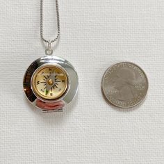 Vintage Silver Necklaces For Travel, Vintage Silver Necklace For Travel, Metal Pocket Watch With Compass Design As Gift, Compass Design Locket Necklace As A Gift, Compass Design Round Pendant Locket Necklace As Gift, Travel Stainless Steel Silver Necklaces, Compass Design Medallion Locket Necklace As Gift, Medallion Locket Necklace With Compass Design For Gift, Vintage Stainless Steel Jewelry With Compass Design