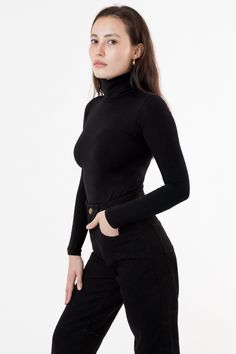 Our classic turtleneck now available in our favorite neutrals and statement bright colors to match our garment dye collection. A tight, fitted turtleneck made of high quality cotton spandex with a full fold-over turtleneck to keep you warm all season long. This top features a mid-length that can still be tucked into high waisted styles and is ideal for layering without adding bulk underneath your favorite sweaters and jackets. We recommend sizing up if you prefer a less fitted look. Please note, Burgundy Dahlia, Los Angeles Apparel, Classic Turtleneck, La Outfits, Turtleneck Style, Garment Manufacturing, Turtleneck T Shirt, Fitted Turtleneck, High Waist Fashion