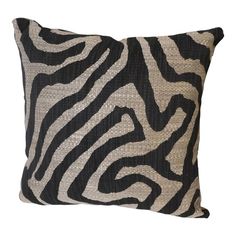 a black and white zebra print pillow on a white background