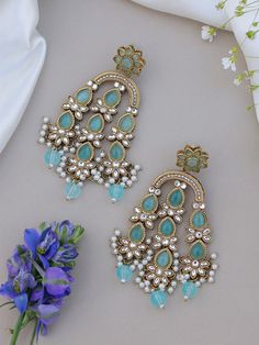 Statement earrings for a statement look! These handmade high quality kundan polki and meenakari ruby green earrings are a unique addition to your outfit to glam it up! These can be paired with both Indian and western outfits. They are also extremely lightweight because they are handcrafted. Easy on your ears and beautiful for the eyes 💖 For any queries, please reach out to us. Happy shopping! Also available in Multicolour and Baby Blue Diwali Outfit Indian, Diwali Outfit, Outfit Indian, Earrings Kundan, Diwali Outfits, Heavy Earrings, Traditional Earrings, Kundan Earrings, Green Earrings