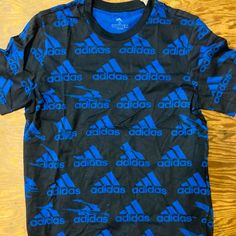 Mens Adidas Tshirt Nwt New! Size S Blue Adidas T-shirt With Logo, Black Adidas T-shirt With Logo, Adidas Black T-shirt With Letter Print, Blue Adidas Logo T-shirt With Short Sleeves, Adidas Black T-shirt With Logo, Blue Adidas T-shirt For Streetwear, Adidas Crew Neck Shirt With Letter Print, Adidas Graphic Tee For Streetwear, Adidas Blue T-shirt For Streetwear