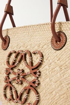 Find LOEWE Paula's Ibiza Small Leather-trimmed Woven Raffia Tote on Editorialist. From reviving heritage techniques to working with skilled artisans, Loewe's Jonathan Anderson supports craft at every opportunity. This tote - designed in collaboration with Paula's Ibiza - has been made in Spain from raffia overlaid with an 'Anagram' emblem. Knot the leather ties to secure the open top. Loewe Paula's Ibiza, Beauty Calendar, Woven Leather Bag, Loewe Bag, Ibiza Fashion, Woven Raffia, Find Color, Small Tote, Open Top