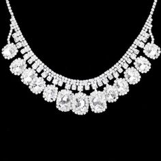 Rhinestone Trim Clear Oval Stone Accented Silver Necklace Set Sparkle Armand Oval Crystal Jewelry With Rhinestones, Oval Shaped Rhinestone Jewelry For Gifts, Oval Rhinestone Jewelry Gift, Oval Crystal Jewelry With Stones, Oval Jewelry With Sparkling Stones For Party, Silver Oval Pendant Jewelry For Party, Silver Oval Necklaces For Party, Oval Jeweled Crystal Jewelry, Oval Costume Jewelry For Parties