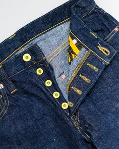 Samurai - "Year of the Tiger" Selvedge Jeans - Middle Straight O/W We were beyond excited to see the "Year of the Tiger" selvedge. The first thing that grabbed our attention was those yellow-coated "Matsunoki" buttons. It's unlike anything we've come across in 10 years of business. Those alone would be enough to get us interested, but you know they don't stop there. They've chosen their infamous 17oz "Zero" fabric developed in 2004. This fabric is so filled with texture that it took an extended time to develop, so you know they spent their time getting it right. There are so many details to discover throughout this pair but pay close attention to those pocket bags. These are going to easily become your favorite pair every time you get your eyes on those yellow-coated buttons. 17oz. "Zero" Yellow Coat, Year Of The Tiger, Selvedge Denim, The Tiger, Pocket Bag, Tiger Print, Leather Patches, Indigo Blue, The Year