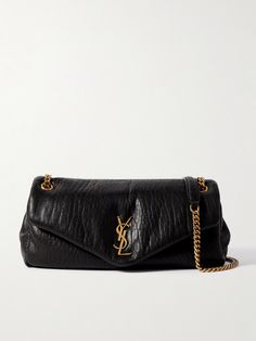 SAINT LAURENT's textured-leather 'Calypso' bag looks and feels so sumptuous. The gold-tone chain strap matches the interlocking 'YSL' plaque for a touch of classic Parisian glamour. It's padded for a little extra structure and has enough space inside for your compact, mints and phone. Saint Laurent Waist Bag, High-end Textured Leather Shoulder Bag For Everyday Luxury, Designer Evening Bags With Grained Texture, Leather Shoulder Bag With Grained Texture For Business, Business Leather Shoulder Bag With Grained Texture, Designer Bags With Grained Texture For Everyday Use, Luxury Grained Texture Shoulder Bag For Business, Elegant Business Shoulder Bag With Grained Texture, Elegant Grained Texture Shoulder Bag For Business