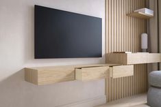 a flat screen tv mounted to the side of a wall