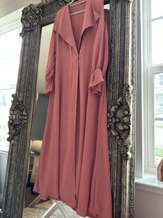 Blush pink abaya with collar and simple flared sleeves for an edgy yet feminine look If you're looking for a great quality Abaya to look chic and modest, then you're at the right shop 🌷 We are certain we will not disappoint! We chose the best materials and worked with the most experienced tailors and designers to bring to you elegant, modern, and modest styles!  Express your modest style with our elegant colorful abayas  Come with scarf  Made in Bahrain Chic Long Sleeve Fall Abaya, Chic Pink Long Maxi Dress, Long Pink Abaya For Eid, Pink Long Abaya For Eid, Modest Pink Abaya For Eid, Modest Long Sleeve Pink Maxi Dress, Pink Long Sleeve Abaya For Eid, Elegant Long Outerwear For Eid, Modest Pink Abaya For Spring