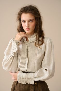 Linennaive's linen blouse is perfect for adding a touch of vintage-inspired romance to your outfit. Crafted from soft linen, the delicate ruffles at the neckline and cuffs elevate its texture and add a soft and romantic feel.  Softly pleated detailing creates a flattering silhouette on this blouse that's sure to stand out. Experience the epitome of elegance and grace with this Linen Blouse. 【Fabric】 100% linen- 200g/gram. Medium weight 【Size】 Based on approximate body measurements. *SIZE XS (US 0-2 | UK/AU 4-6 | DE 32-34 | FR 34-36 | IT 38-40 | RU 40-42 | JP 7-9) bust: 32.5"-33.5" / 81-85 cm *SIZE S (US 4-6 | UK/AU 8-10 | DE 34-36 | FR 36-38 | IT 40-42 | RU 42-44 | JP 9-11) bust: 34.5"-35.5" / 87-90 cm *SIZE M (US 8-10 | UK/AU 12-14 | DE 38-40 | FR 40-42 | IT 44-46 | RU 46-48 | JP 13-15) b Feminine Beige Linen Blouse, Spring Cottagecore Linen Blouse, Elegant Beige Linen Top, Vintage Linen Blouse For Fall, Long Sleeve Linen Blouse With Ruffles, Ruffled Linen Blouse, Feminine Linen Blouse With Puff Sleeves, Elegant Linen Spring Blouse, Vintage Beige Linen Blouse