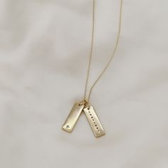 Give the gift of customization this holiday season with our gold filled tag necklace. Keep it simple with one tag or create a stacked looked and add multiple tags with different customizations to create a unique and timeless piece. Names, dates, etc. make the most thoughtful gift! These pieces are engraved in house and made to order! Include your customization in the note section on the cart page! Standard chain length is 17" with 2" of extender chain for adjusted length. Looking for a longer le Minimalist Gold Birthstone Necklace With Charms, Personalized Pendant Charm Necklace In Recycled Gold, Minimalist Name Necklace With Charms For Anniversary, Yellow Gold Name Necklace With Charms For Everyday, Elegant Everyday Hand Stamped Charm Necklaces, Minimalist Hand Stamped Necklace For Personalized Gift, Minimalist Hand Stamped Rectangular Pendant Necklace, Everyday Yellow Gold Name Necklace With Charms, Personalized Yellow Gold Charm Necklace In Recycled Gold