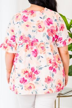 Grab this beauty while you still have a chance! This top features a lovely floral pattern and a pretty peach coral color that is sure to stand out! The flowy fit makes it perfect for a casual day out! 100% Polyester Peach Feminine Blouse For Day Out, Feminine Peach Blouse For Day Out, Peach Blouse For Beach, Spring Season, Peach Blouse For Beach In Spring, Peach Blouse For Spring Beach Occasions, Feminine Peach Tops For Beach, Feminine Peach Top For Spring, Feminine Peach Tops For Spring, Feminine Peach Tops For The Beach