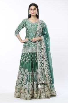 Dark green lehenga with all-over floral zardozi embroidery and kiran fringed hem. Comes with coordinating embroidered short kurta and matching dupatta. - Aza Fashions Semi-stitched Green Choli For Eid, Festive Green Embroidered Lehenga, Semi-stitched Green Lehenga With Dupatta, Green Semi-stitched Lehenga With Dupatta, Green Art Silk Lehenga With Zari Work, Green Bollywood Choli In Dola Silk, Green Art Silk Lehenga For Festive Occasions, Bollywood Style Green Art Silk Lehenga, Green Bollywood Art Silk Lehenga