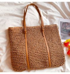 Chic Summer Bags Made Of Natural Fiber, Chic Beach Bag Made Of Natural Fiber, Spring Travel Beach Bag Made Of Rattan, Trendy Brown Straw Bag, Spring Handheld Straw Beach Bag, Trendy Handwoven Straw Shoulder Bag, Eco-friendly Handheld Shoulder Bag For Summer, Straw Shoulder Bag For Everyday Summer Use, Trendy Woven Straw Bag