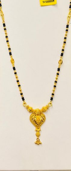 "Black beads chain necklace, 916 Yellow Gold GOLD PURITY : 916 gold purity Weight: 13.40 grams Size : 24\" inches Length Colour : YELLOW GOLD Hallmark: Hallmarked 916 stamp Hook: '' no hook. (Wear over head) Design : Mangalsutra necklace with black beads. Authentic 916 Gold by Mbrilliance FAQs Q: Is it real gold? A: yes it's real authentic genuine 916 gold Q: can pawn? A: yes it's pawnable ⭐️GoForGold⭐️" Luxury 22k Gold Traditional Mangalsutra, 22k Gold Necklaces For Puja, Yellow Gold Necklace With Intricate Design For Puja, Intricate Yellow Gold Necklace For Puja, Festive 22k Gold Locket Necklace, 22k Gold Locket Necklace In Temple Jewelry Style, 22k Gold Locket Temple Necklace, Black Necklace With Intricate Design For Festivals, Black Necklaces With Intricate Design For Festivals