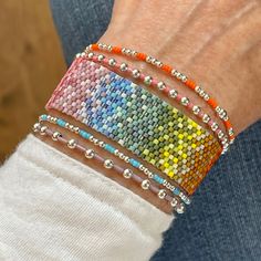 Rainbow Beaded Bracelet Stack with Flat Beaded Bracelet & Silver Stretch Bracelets as a Set & Singles. Cheap Rainbow Stretch Bracelet With Tiny Beads, Cheap Rainbow Round Beaded Bracelets, Adjustable Hand-strung Silver Friendship Bracelets, Sterling Silver Beaded Bracelets With Tiny Beads For Everyday, Handmade Silver Friendship Bracelets With Round Beads, Silver Friendship Bracelets With Silver Beads, Everyday Beaded Sterling Silver Bracelets, Silver Beaded Friendship Bracelets, Everyday Sterling Silver Beaded Bracelets