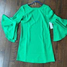 Beautiful Green Color Dress With Plunge Back And Long Ruffle 3/4 Sleeves Never Had Anywhere Fun To Wear It To! From Red Dress Boutique. Green 3/4 Sleeve Party Dress, Green 3/4 Sleeve Dress For Party, Green Ruffle Sleeve Mini Dress For Spring, Elegant Mini Dress With 3/4 Sleeves For Day Out, Green Mini Dress With Ruffle Sleeves For Spring, Green Ruffle Sleeve Dress For Brunch, Chic 3/4 Sleeve Dress With Ruffles, Green Fitted Mini Dress With Ruffle Sleeves, Chic Green Mini Dress With Flutter Sleeves