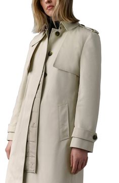 The classic trench is refreshed to tackle colder climates in this insulated coat boasting a removable liner and rain-shedding storm and gun flaps. 38" length (Extra-Small) Front button closure Notched collar; removable throat latch Belted cuffs Front welt pockets Storm flap Removable belt Temperature rated to -5°C Back vent Removable lining, with recycled-polyester fill 65% polyester, 35% cotton with 100% polyester contrast Dry clean Imported Fitted Coat, Down Puffer Coat, Long Sleeve Outerwear, Maxi Coat, Classic Coats, Trench Coat Black, Notched Collar, Down Coat, Outerwear Coats