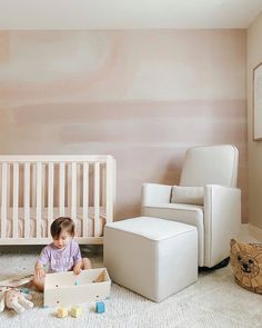 Welcoming Watercolor 🎨 We love the painterly streaks of light salmon and dashes of mauve in @myfourwonders’ sweet nursery 💕 It’s a minimal space, but more than equipped for playing and dreaming. Featuring our Colby 4-in-1 Crib in a bright and beachy Washed Natural finish, and our Olive Glider and Ottoman, which have been upholstered with a delicate but durable eco-performance fabric that will stand the test of time ⭐ #nurserymural #watercolor #mural #pinknursery #nurseryinspo #nurseryideas #ar 4 In 1 Crib, Watercolor Mural, Sweet Nursery, Pastel Nursery, Glider And Ottoman, Lower Back Support, Nursery Mural, Light Salmon, Minimal Space