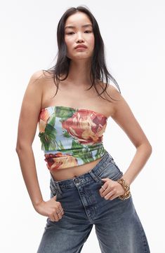 Painterly blooms artfully adorn this strapless crop top that shows off your shoulders. 14 1/2" length (size medium) Strapless 100% polyester Machine wash, line dry Made in Turkey lined Strapless Crop Top For Summer, Spring Bandeau Crop Top, Strapless Summer Crop Top, Strapless Fitted Crop Top For Spring, Fitted Strapless Crop Top For Spring, Floral Print Bandeau Top For Party, Spring Cropped Tube Top, Summer Floral Print Bandeau Crop Top, Spring Strapless Trendy Crop Top