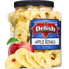 apple rings in a glass jar with an apple on the side and delish's logo