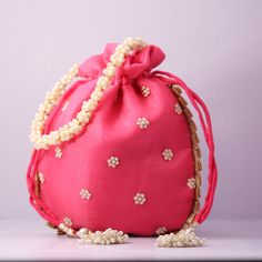 Elegant Pink Shoulder Bag For Festivals, Elegant Pink Handmade Potli Bag, Elegant Pink Shoulder Bag For Festive Occasions, Pink Handwork Pouch Bag, Traditional Pink Shoulder Bag For Evening, Pink Shoulder Bag With Handwork For Party, Pink Bags For Evening And Festivals, Elegant Pink Potli Bag For Festivals, Elegant Pink Evening Bag For Festive Occasions