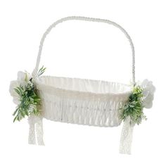 a white basket with flowers on it