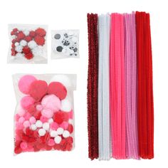 assorted pom poms in plastic bags on a white background with other items