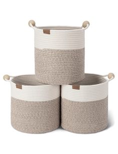 three round baskets with handles on each side and two large ones in the middle, one white