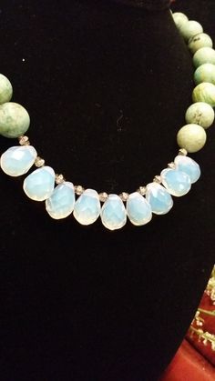 "This is a gorgeous, one of a kind, statement necklace designed and hand crafted personally by Petronella Greer. It's a 1 strand design, made of a light turquoise and opalite that turns colors. The length of the necklace is 18\". The clasp is high quality. It's an exquisite and unique piece of jewelry that no one else will have but you! Also, comes in very nice packaging!" Turquoise Chrysoprase Beaded Necklace For Gift, Turquoise Beaded Necklace For A Gift, Handmade Turquoise Chrysoprase Necklaces, Turquoise Chrysoprase Gemstone Bead Necklaces, Elegant Adjustable Turquoise Necklace With Faceted Beads, One-of-a-kind Turquoise Amazonite Jewelry, Turquoise Teardrop Faceted Beads Jewelry, Turquoise Teardrop Necklace With Faceted Beads, Turquoise Teardrop Amazonite Jewelry