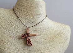 This handmade carved wooden cross necklace was made from pear wood, polished and finished with fine tung oil. This hippie style wood cross can be perfect gift for man or gift for woman. CROSS GALLERY : https://www.etsy.com/shop/NikibarsNatureArt?section_id=16787849&ref=shopsection_leftnav_5 cross height - 1 7/8 inches (47 mm) The length of the cord is about 30 inches (77 cm), but it can be regulated by the movable knot. Materials utilised: pear wood, waxed cord Production method 100% hand ma Wooden Cross Necklace, Abstract Cross, Pear Wood, Cross Art, Wood Cross, Tung Oil, Wood Crosses, Wooden Cross, Carved Wood