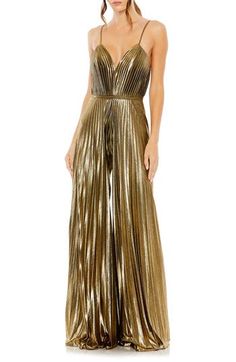 Enter your next special event in a disco-chic manner with this crisp, accordion-pleated jumpsuit styled with flowy wide legs, slender straps and a banded waist. 61" length; 31 1/2" inseam; 136" leg opening (size 8) Plunge neck Spaghetti straps Partially lined 100% polyester Spot clean Imported Asian Owned/Founded Jumpsuit For Wedding Guest, Pleated Jumpsuit, Formal Jumpsuit, Mac Duggal, Jumpsuit Fashion, Sleeveless Jumpsuits, Gold Dress, Wide Leg Jumpsuit, Evening Wear