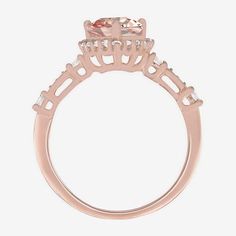 Add glamor to your day or night styling with this Yes, Please! cocktail ring. Crafted from 14k Rose Gold Over Silver, this halo ring has a pear-shaped Lab Created Pink Sapphire surrounded by Lab Created White Sapphires. Style it with a similar toned necklace or stud earring set. Ring Style: Cocktail RingsFeatures: In A Gift BoxSetting: ProngStone Cut: Multi-ShapeMetal Color: RoseRing Gallery Height: 6.9mmCare: Wipe CleanStone Type: 53 Lab Created SapphireAuthenticity: Lab Created StoneMetal: 14… Formal Pink Gold Rings With Halo Setting, Formal Pink Gold Halo Setting Rings, Rose Gold Morganite Ring With Halo Design, Elegant Rose Gold Birthstone Ring With Center Stone, Elegant Pink Gold Birthstone Promise Ring, Elegant Pink Gold Crystal Wedding Ring, 14k Rose Gold Halo Promise Ring, Elegant Pink Gold Crystal Ring For Promise, Elegant Rose Gold Crystal Ring For Anniversary