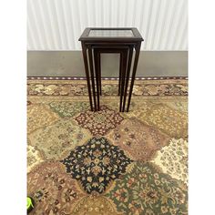 two end tables sitting on top of a rug