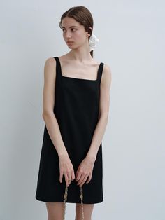 This product, a Square Neck Mini Dress, marries simplicity with sophistication in its design. The dress features a straight, clean silhouette which allows for versatile styling options, making it suitable for both casual and more formal occasions. The square neckline provides a modern touch that frames the face beautifully, while the sleeveless cut enhances its elegant yet understated appeal. - This Square Neck Mini Dress is meticulously tailored to sit comfortably above the knee, ideal for showcasing statement footwear.- Its square neckline is complemented by thin straps that provide support without compromising the minimalist design.- The dress is crafted from a smooth fabric, ensuring a sleek fit and a polished finish.- The straightforward, unadorned style makes it a perfect canvas Low Square Neckline Dress, Straight Silhouette Dress, Square Neckline Dress, Square Neck Mini Dress, Square Neck Dress, Mini Dress Black, Dress Silhouette, Everyday Dresses, Square Necklines