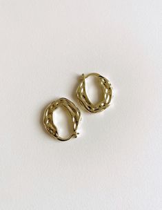 Size: about 22.6mm wide, 25.6mm long, 6.2mm thick, pin: 1.5mm. Hammered hoops are a must-have accessory for their unique blend of timeless elegance and modern flair. Made of high-quality brass and plated with real 18K gold, these earrings offer a luxurious finish that enhances their sophisticated appeal.  The hammered texture adds a distinctive, artisanal touch to the classic hoop design, creating a surface that catches and reflects light beautifully. This subtle yet striking detail sets them apart from traditional smooth hoops, offering a fresh take on a staple piece. Their versatility makes hammered hoops a valuable addition to any jewellery collection. They can effortlessly transition from day to night, complementing both casual and formal outfits. Pair them with a simple blouse and jea Brass Hoop Earrings, Hoops Gold, Brass Hoops, Hammered Brass, Hoop Design, Simple Blouse, Formal Outfits, Jewelry Earrings Hoops, Jewelry Lover