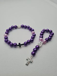 Matching set of handmade pocket rosary and bracelet  ☆ Glossy dark and light purple pearl beads ☆ Silver crosses and Blessed Mother charm Handmade in Scotland, Little Prayers, prayer beads are perfect for those little moments throughout your day. Through your hard times or times you want to give your thanks these beads will be the perfect tool for your prayers. Little Prayers are hand made one by one with love and hope that they will bring you comfort and happiness. Purple Rosary With 8mm Round Beads, Purple Rosary With 8mm Beads, Handmade Adjustable Purple Rosary, Adjustable Purple Rosary Bracelet, Adjustable Purple Rosary Bracelet With 8mm Beads, Purple Beaded Rosary As Gift, Adjustable Purple Spiritual Rosary Bracelet, Handmade Spiritual Purple Rosary Bracelet, Pocket Rosary