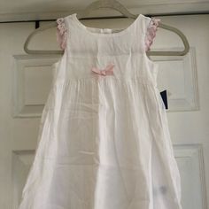 * Nwt * Size 4t * Fully Lined * White Dress With Pink Details * Button Closure White Button-up Dress For Dress-up Occasion, White Dress With Buttons For Dress-up, Casual Dresses With Buttons For Playtime, Cute White Dresses With Buttons, Sleeveless Button-up Dress For Dress-up Occasions, Sleeveless Dress-up Dress With Buttons, Sleeveless Dress With Buttons For Dress-up, Sleeveless Dress With Buttons For Dress-up Occasions, Sleeveless Button Dress For Formal Occasions