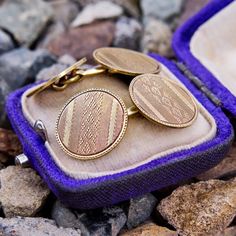 This handsome pair of antique cufflinks each feature two machine engraved discs attached with a gold chain. They are crafted in patinated 14k yellow gold. Ceremonial Gold Jewelry With Screw Back, Formal Antique Gold Jewelry Stamped 14k, Formal Etched Bronze Jewelry, Formal Engraved Bronze Jewelry, Formal Antique Gold Etched Jewelry, Antique Gold Cufflinks For Collectors, Antique Yellow Gold Cufflinks For Formal Occasions, Antique Gold Cufflinks, Antique Yellow Gold Formal Cufflinks