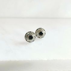 Black diamond post earrings Stunning crystal studs are perfect day or night. The black diamond Swarovski Crystal Chaton is surrounded by slightly lighter but still silver channeled crystals. Each entire setting is vintage (and hard to find) measuring 8mm (.25") in diameter and is adhered to silver tone ear posts. Perfect for adding sparkle to every day or for a special occasion. *The third picture is for sizing not the same shade as listed. Copyright ©, all rights reserved. LoveYourBling® is an Classic Black Diamond Earrings For Anniversary, Round Earrings With Black Diamonds And Cubic Zirconia, Black Diamond Round Earrings, Anniversary Black Diamond Earrings, Classic Sterling Silver Earrings With Diamond Eyes, Sterling Silver Earrings With Black Diamonds For Anniversary, Silver Earrings With Diamond Eyes For Anniversary, Diamond Eyes Earrings For Anniversary, Vintage Silver Round Diamond Earrings