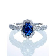 an oval blue sapphire and diamond ring