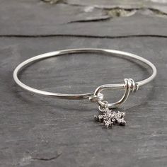 Silver Snowflake Bangle Bracelet Casually Chic, Silver Plated Bracelet, Silver Snowflakes, Hook Clasp, Chic Outfit, Wire Bracelet, Cozy Sweater, Jewelry Trends, Winter Wardrobe