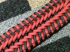 red and black braided fabric laying on top of each other