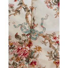 an image of a flowered fabric with snake and flowers on the bottom half of it