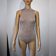 Nytt Nude And Black Strip Bodysuit Sz Xsmall Brand New Without Tags Msrp $79. It’s 95% Rayon 5% Spandex. This Can Fit Up To A Medium It Is Super Stretchy. Elevate Your Wardrobe With This Stunning Nytt Bodysuit In A Chic Black And Beige Color Scheme. Crafted From High-Quality Materials, This Piece Is Perfect For Any Fashionable Woman Looking To Make A Statement. Designed With A Flattering Fit And Versatile Style, This Bodysuit Is An Essential Addition To Any Wardrobe. Featuring A Brand New, Never Chic Beige Lined Bodysuit, Chic Sleeveless Beige Bodysuit, Beige Stretch Bodysuit For Night Out, Stretch Beige Bodysuit For Night Out, Beige Color Scheme, Woman Looking, Black And Beige, Versatile Style, Beige Color