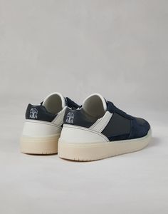 Semi-polished calfskin and washed suede basket sneakers The sporty feel of the Basket sneakers is updated thanks to new, refined materials. The smooth and compact texture of semi-polished calfskin is combined with washed suede details that introduce a subtle texture contrast with the upper. A lightweight rubber bottom provides added comfort. Blue Low-top Calf Leather Sneakers, Navy Low-top Custom Sneakers With Cushioned Midsole, Custom Navy Low-top Sneakers With Abzorb Midsole, Sporty Navy Sneakers With Leather Sole, Blue Calf Leather Sneakers With Contrast Sole, Texture Contrast, Blazer And T Shirt, Man Blazer, Blazer And Skirt