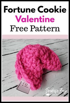 a pink crocheted hat with the text fortune cookie valentine free pattern