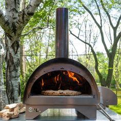 a pizza is cooking in an outdoor oven